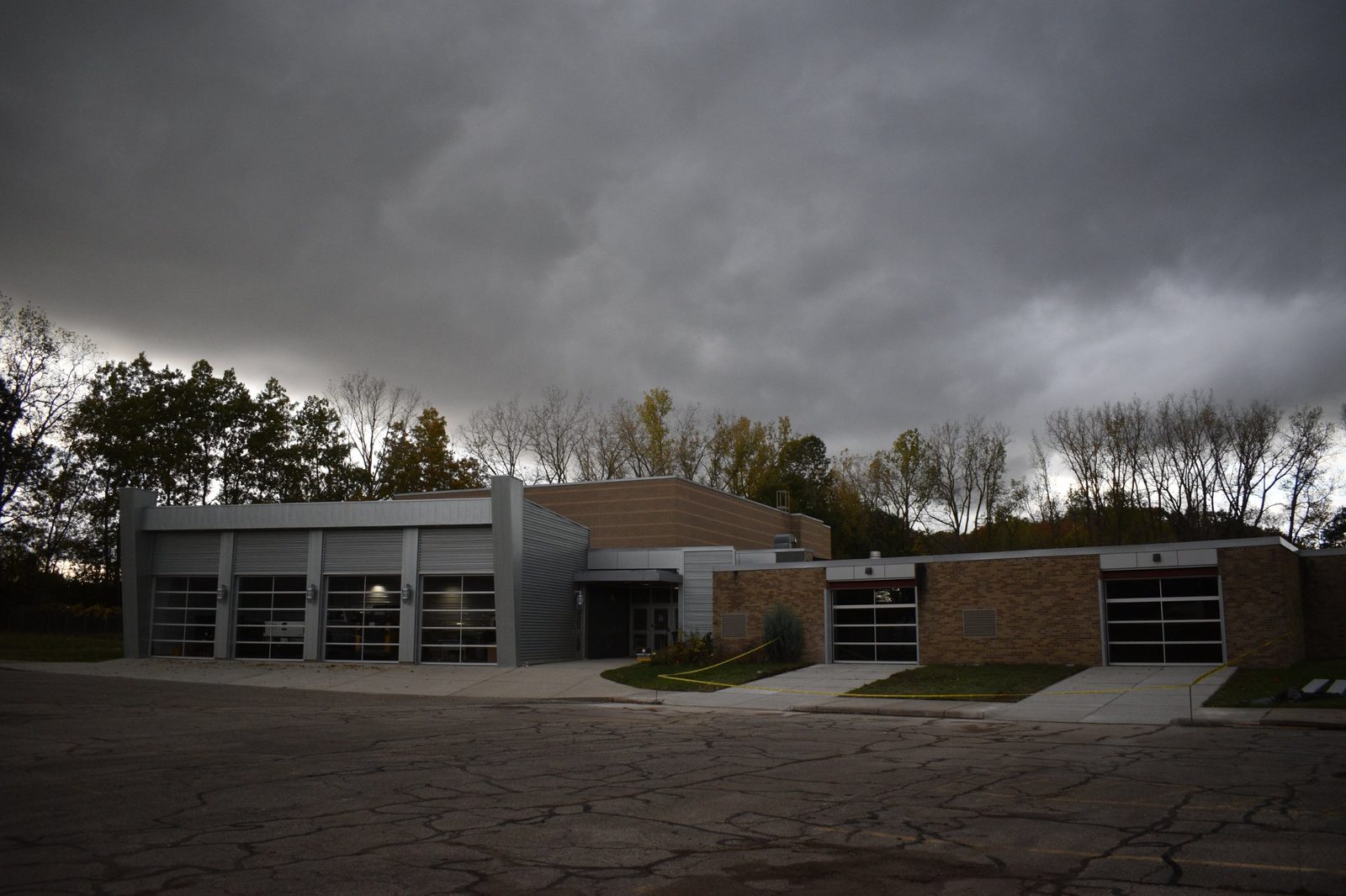The front of the building at 155 E. Glass Rd. with its glass garage doors, seen from the lot where Cars and Coffee is held.